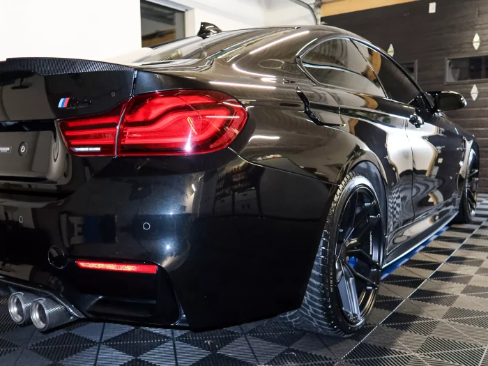 Ceramic coated car paint showing deep gloss and enhanced clarity under studio lighting