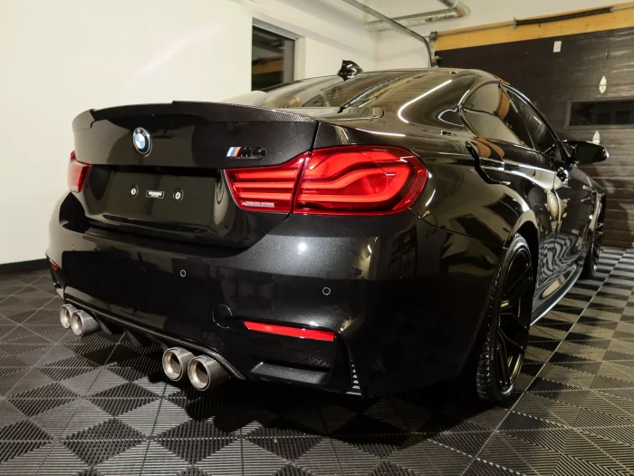 Professional exterior car detailing result showing a smooth and glossy finish